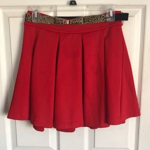 Red pleated skirt with belt